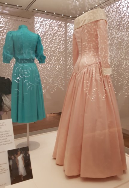 The rear​ of two Catherine Walker dresses that Diana wore for official functions, in 1983 and 1987 (left to right).